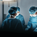 Surgical team performing an operation in a hospital theatre, illustrating that surgery is one treatment option for Peyronie’s disease in selected cases.